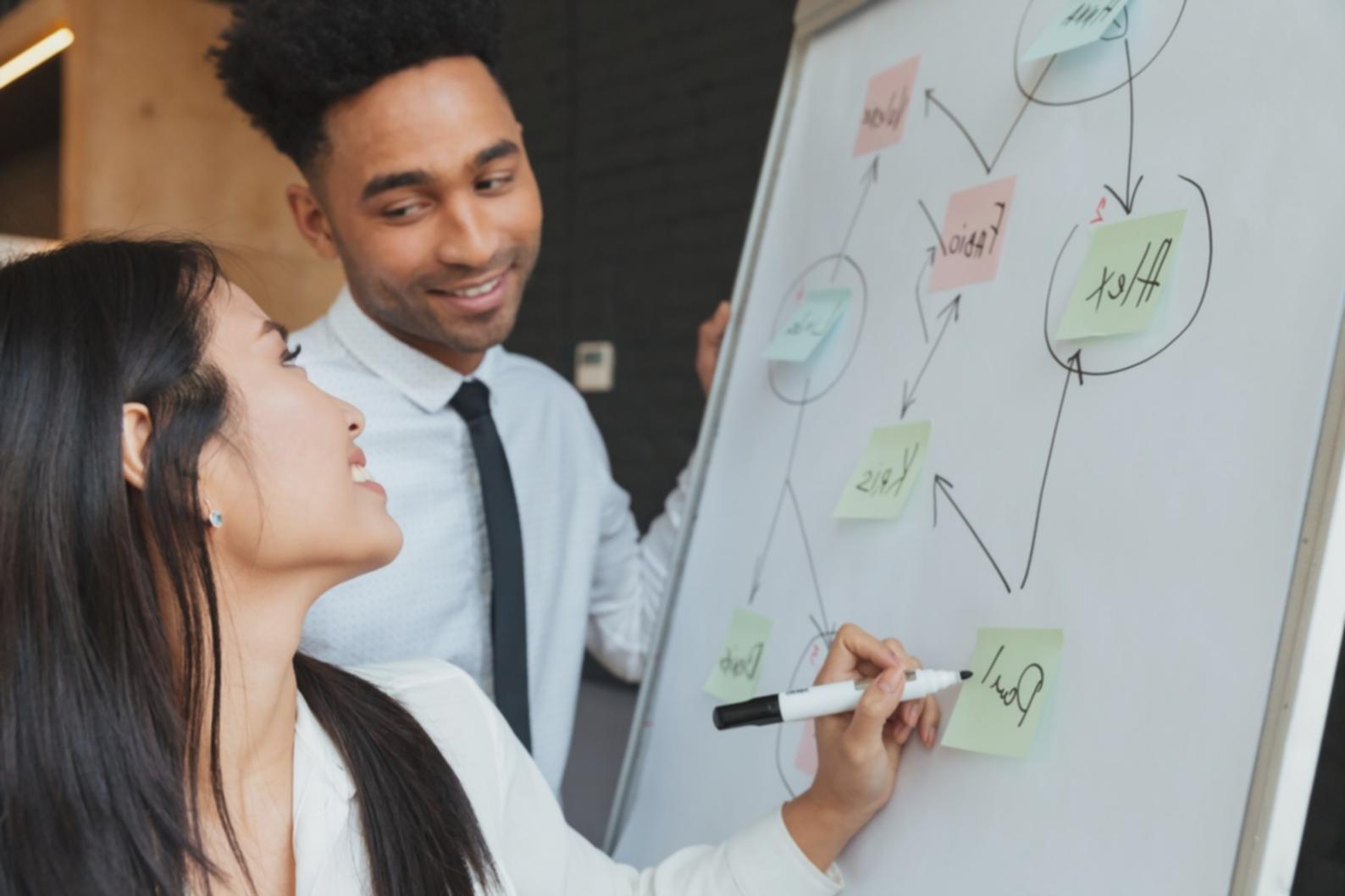 Interactive workshop session with students reviewing investment portfolios